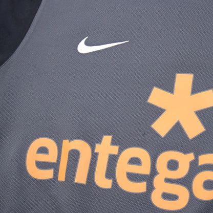 Close-up of Nike swoosh and Entega sponsor logo on the chest
