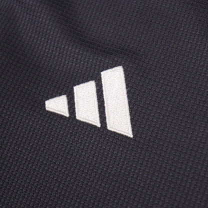 Close-up of the embroidered adidas logo on the Juventus third shirt