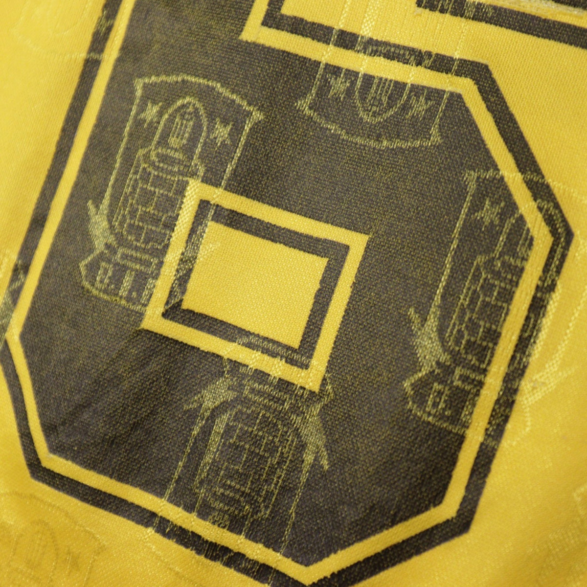 Close-up of Brøndby IF crest jacquard pattern on shirt fabric