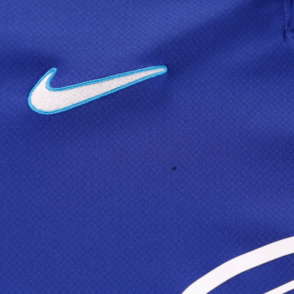 Close-up of the shirt fabric showing a small mark near the shoulder