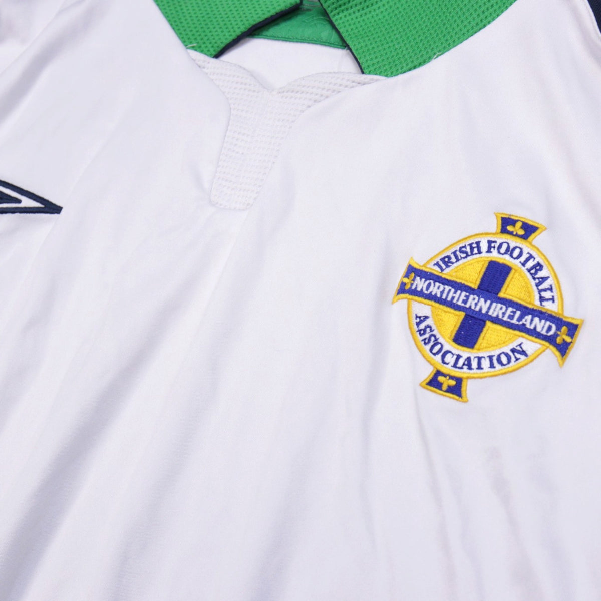 Close-up of the Irish Football Association crest on the Northern Ireland away shirt