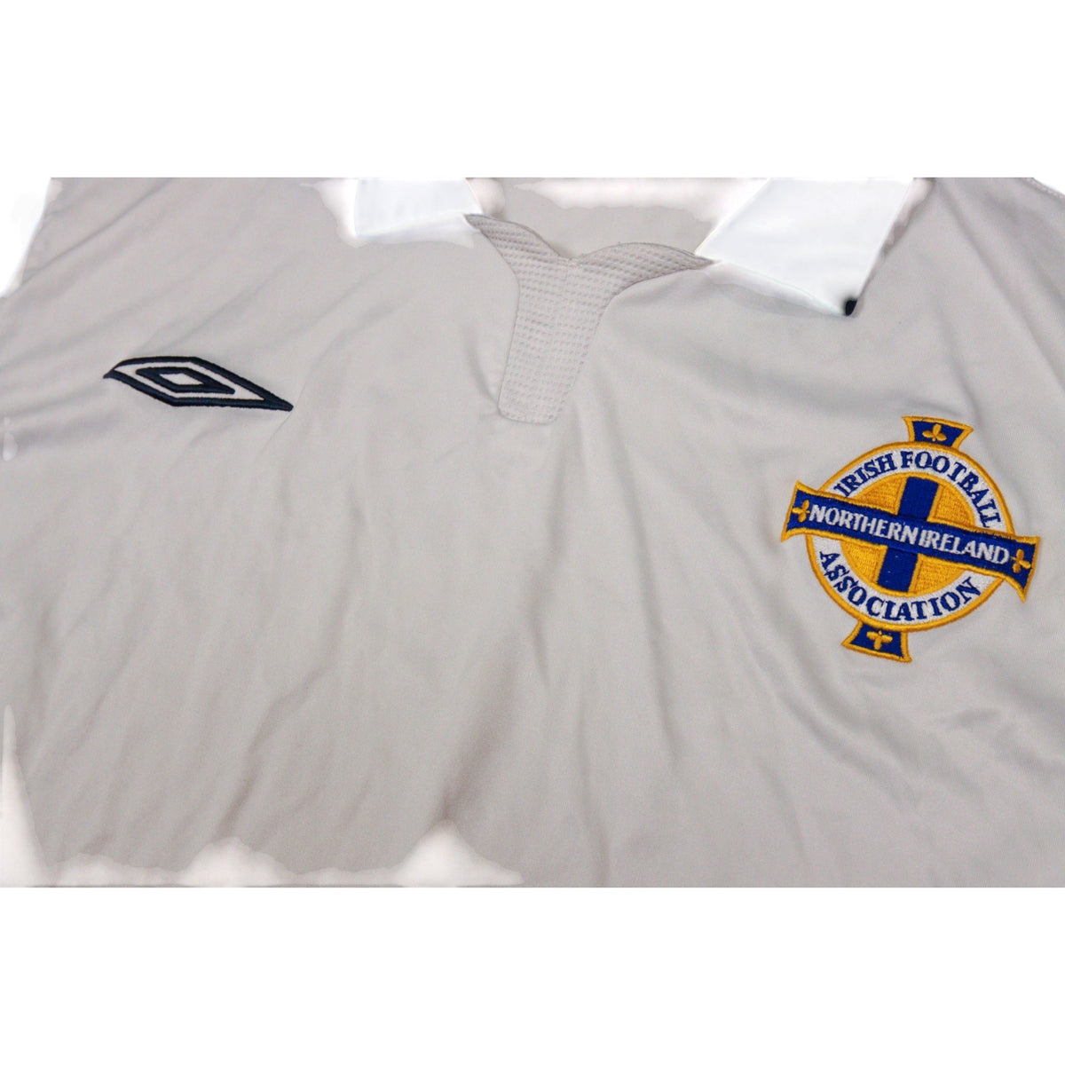 Close-up of Northern Ireland crest and Umbro logo on chest