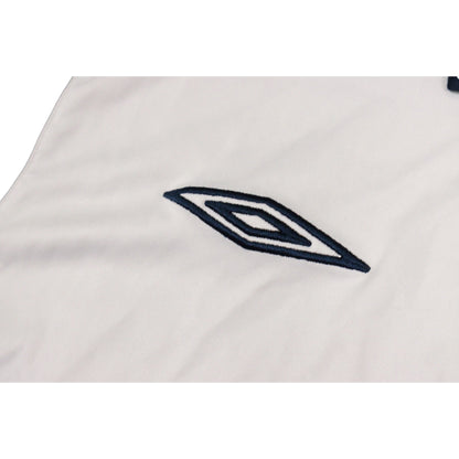 Close-up of Umbro diamond logo embroidered on chest
