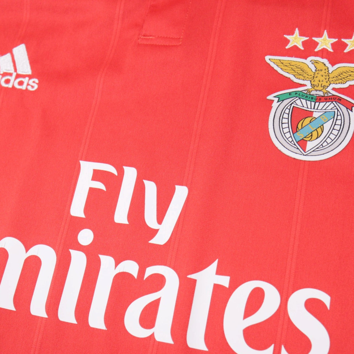 Close-up of Benfica crest, adidas logo and Fly Emirates sponsor on the shirt front