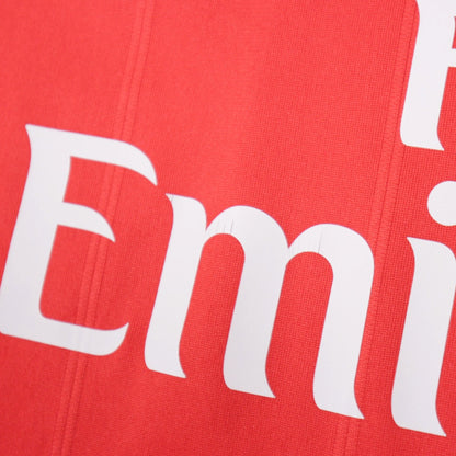 Close-up of the Fly Emirates sponsor print on the shirt