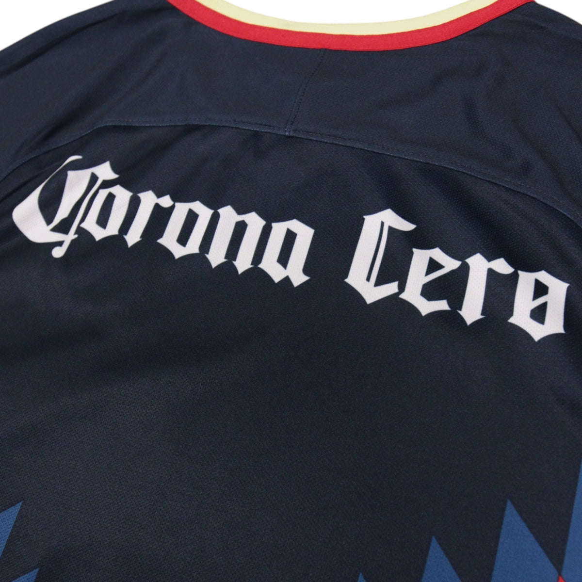 Close-up of the América crest and Nike logo on the shirt