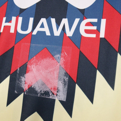 Close-up of the Huawei sponsor print and chest graphic showing a faint mark