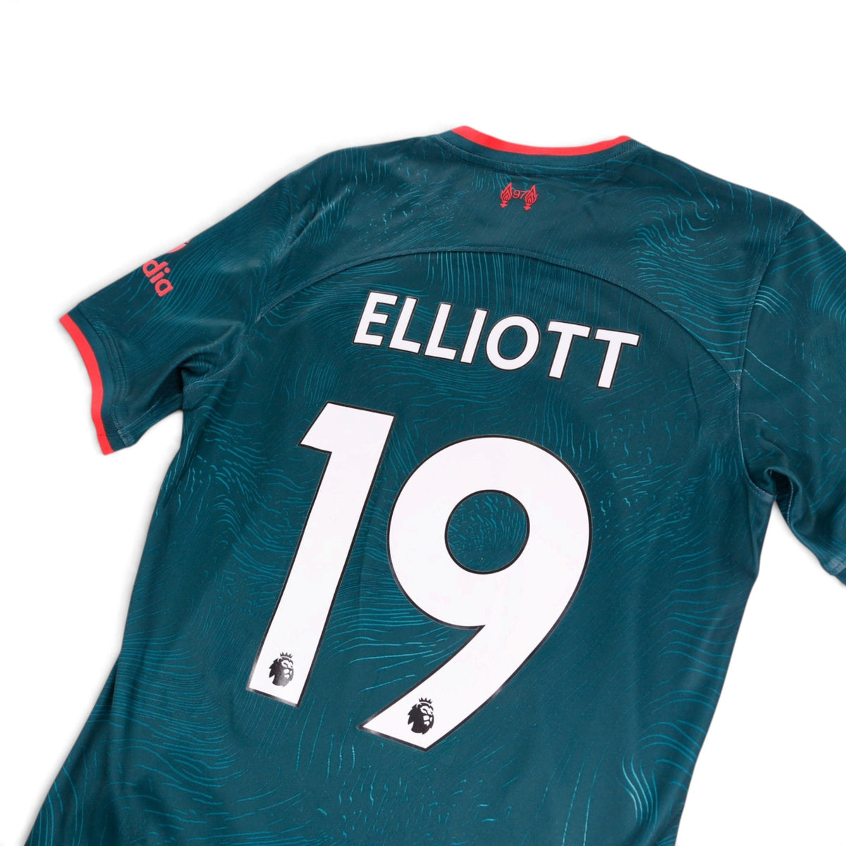 Close-up of Elliott 19 printing on the back of the Liverpool third shirt