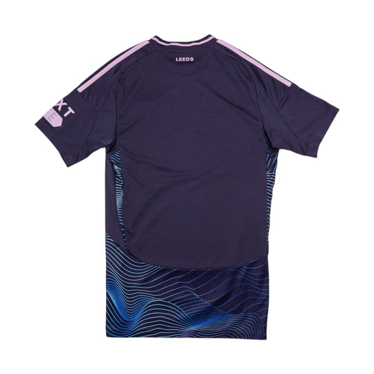 Back of navy Leeds United third shirt showing plain number area and pink collar trim