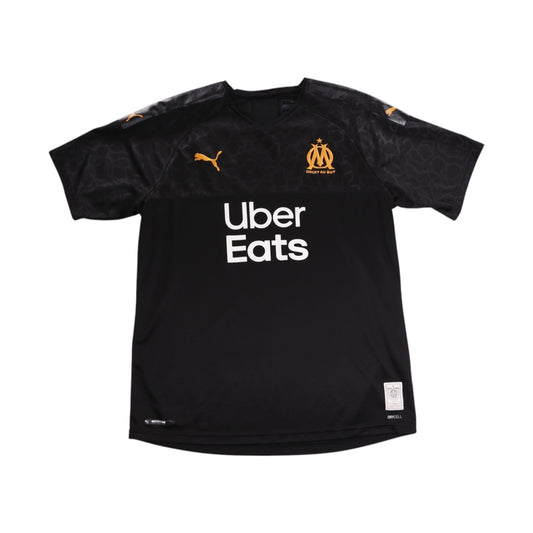 Front of black Olympique Marseille 2019/20 Puma third shirt with Uber Eats sponsor and OM crest