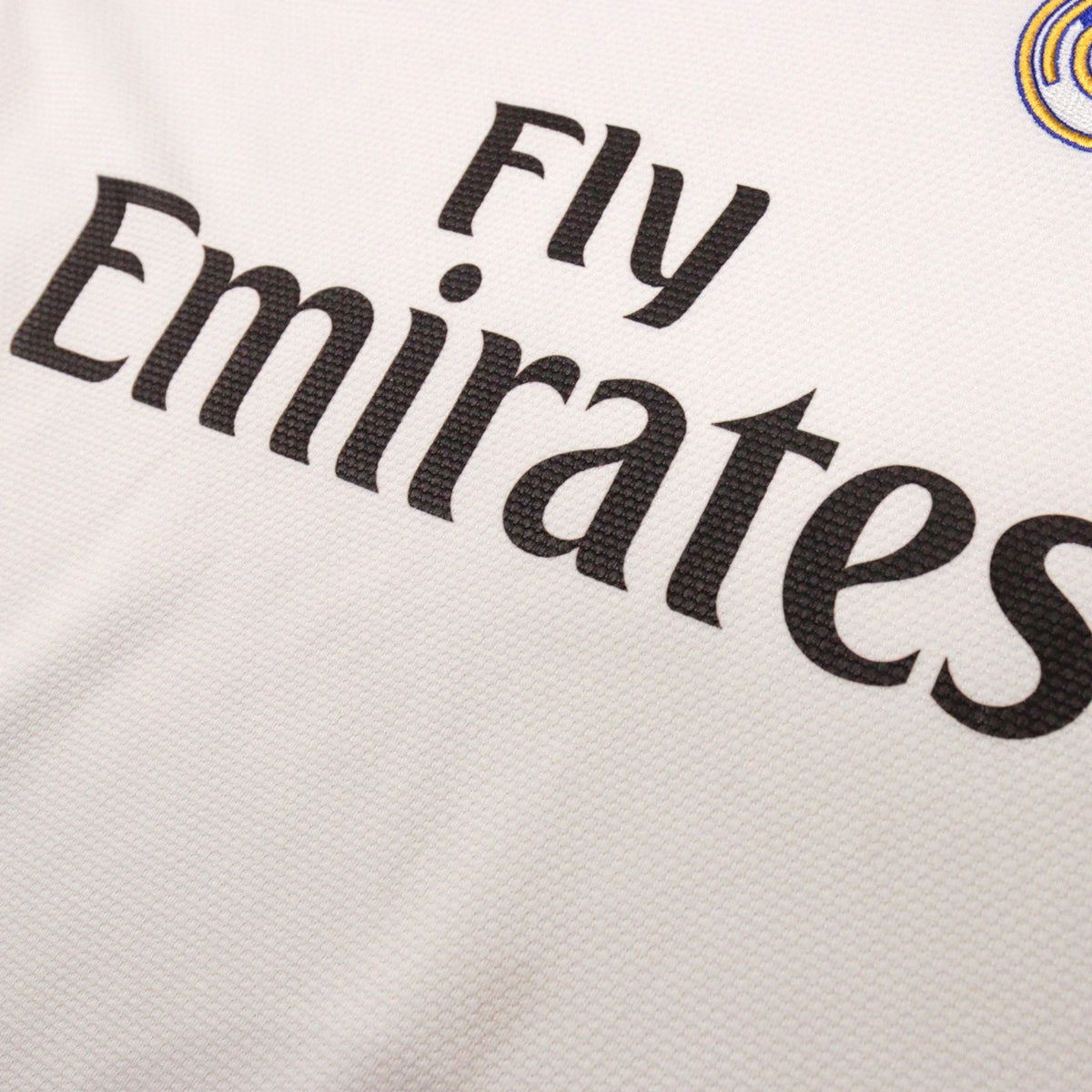 Close-up of Fly Emirates sponsor print on Real Madrid shirt