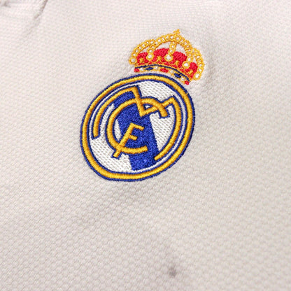 Close-up of Real Madrid crest on shirt chest