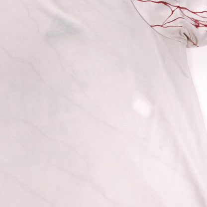 Close-up of shoulder fabric on Arsenal away shirt showing marble print detail