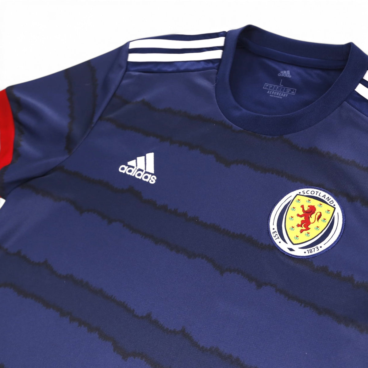 Close-up of adidas logo, Scotland crest and neck label size L