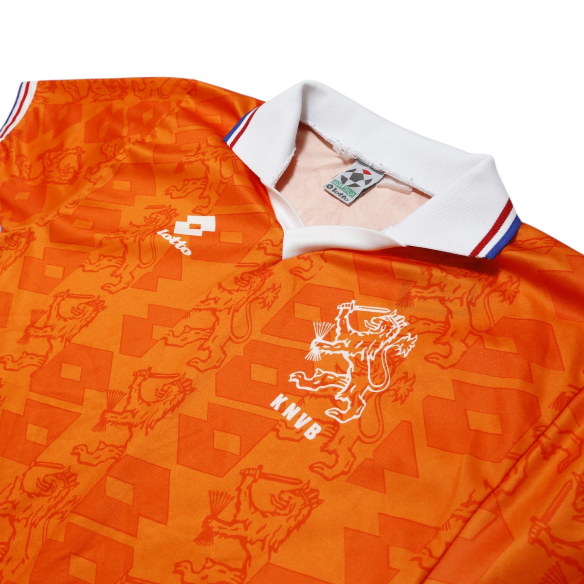Close-up of Netherlands shirt collar, Lotto logo and KNVB crest with size label