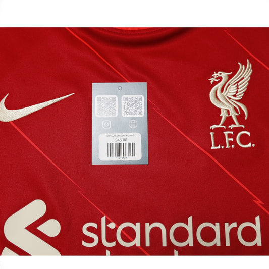 2021-22 Liverpool home shirt front detail with hangtag and crest