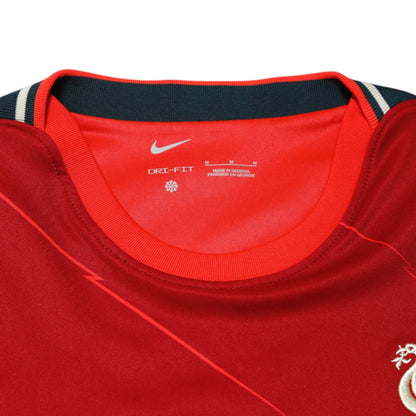 Nike collar label showing size M and Dri-Fit fabric detail