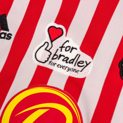 Close-up of the 'for bradley' charity patch on the home shirt