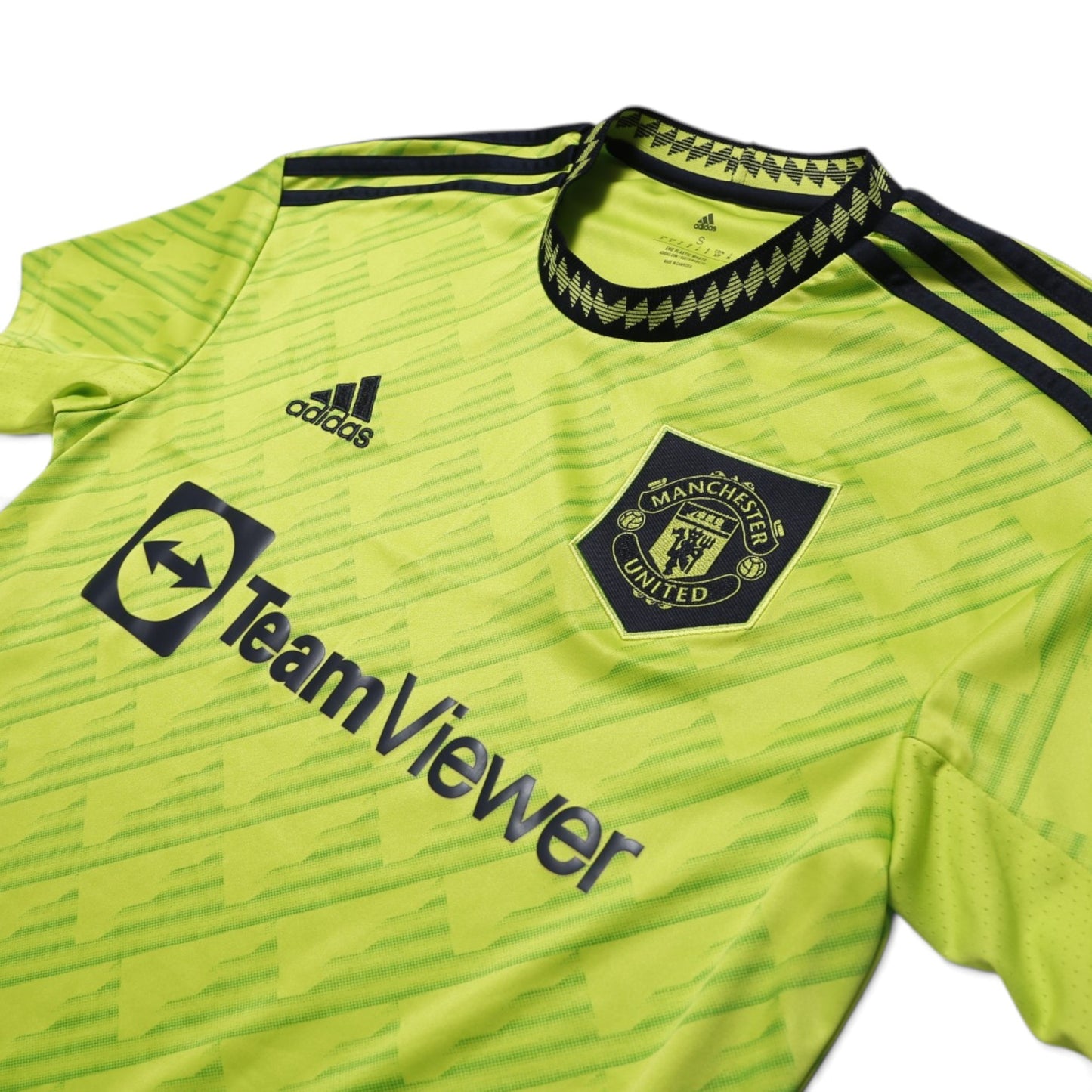 Manchester United 2022-23 third shirt crest and Adidas logo close-up