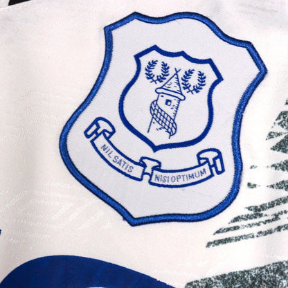 Close-up of embroidered Everton crest on shirt