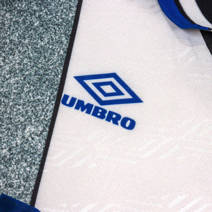 Close-up of Umbro logo printed on chest