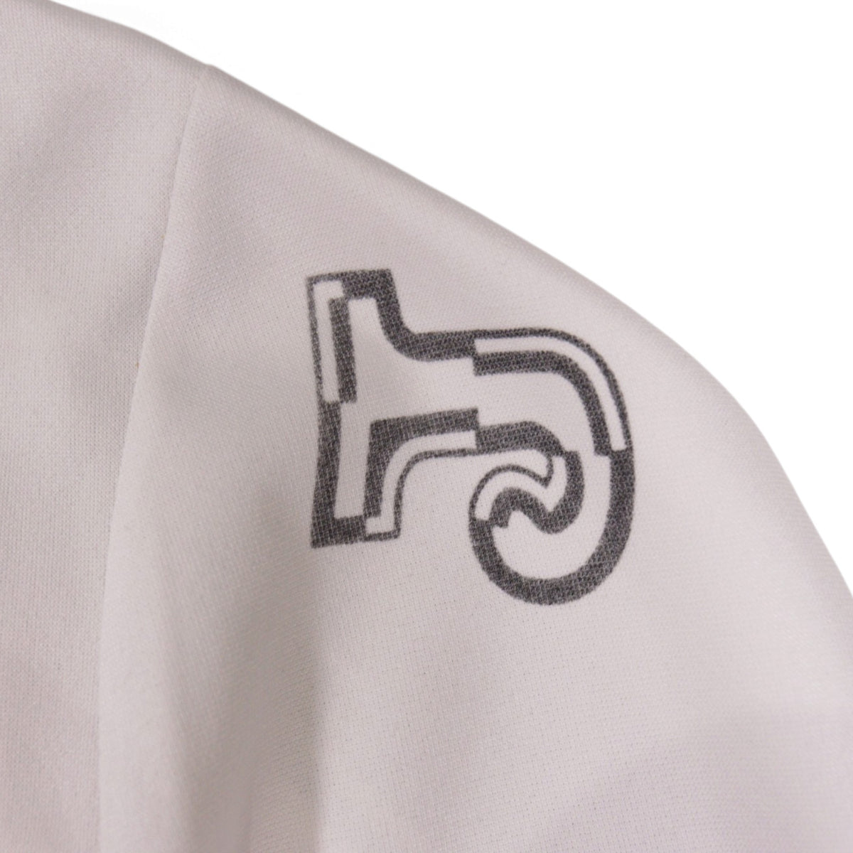 Close-up of the manufacturer's logo on the left sleeve