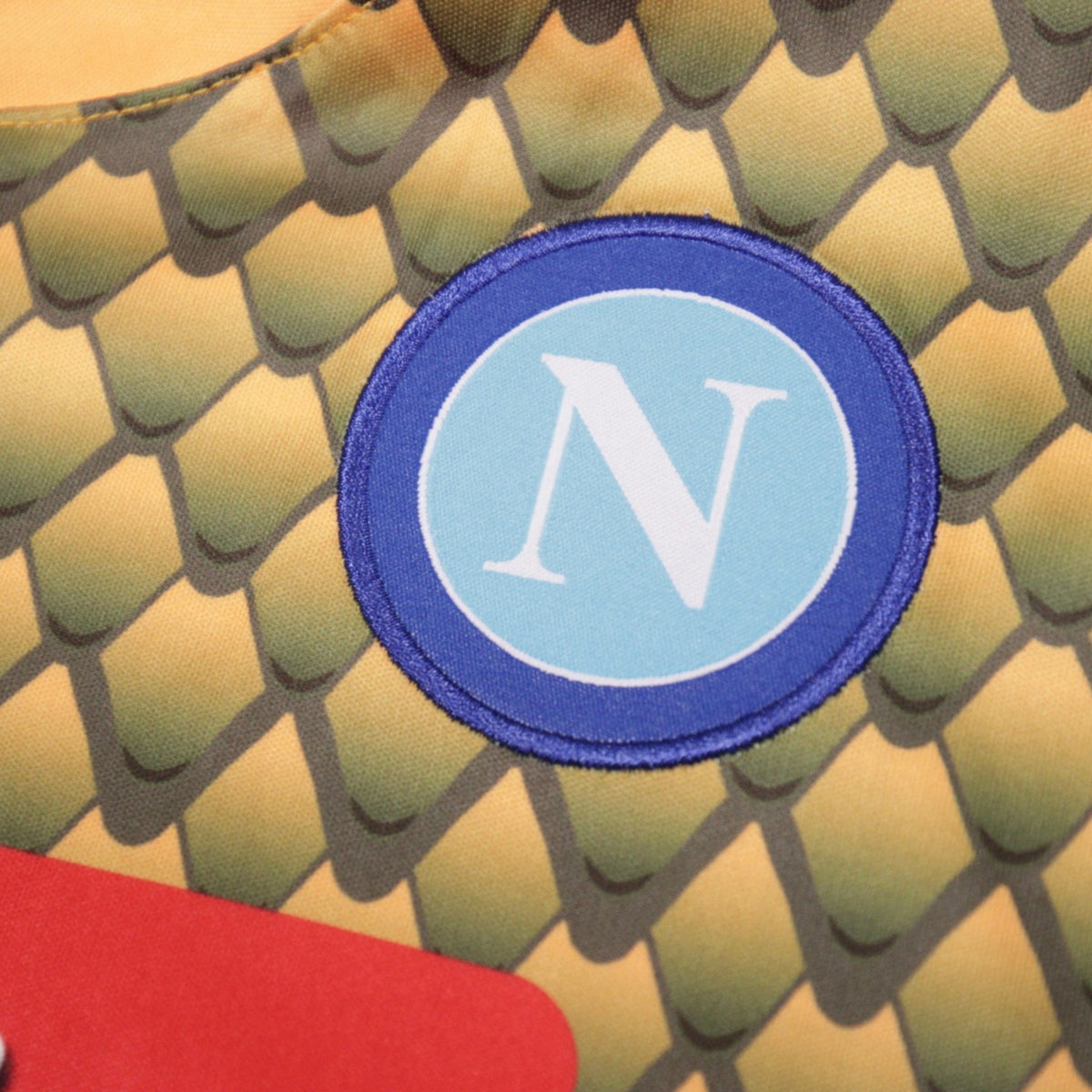 Close-up of the Napoli club crest on the chest of the goalkeeper shirt