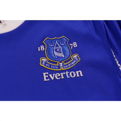 Close-up of Everton crest detail on blue shirt fabric