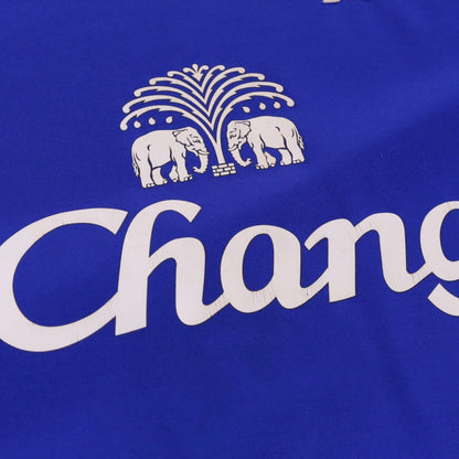 Close-up of Chang sponsor logo with fountain and elephants on shirt