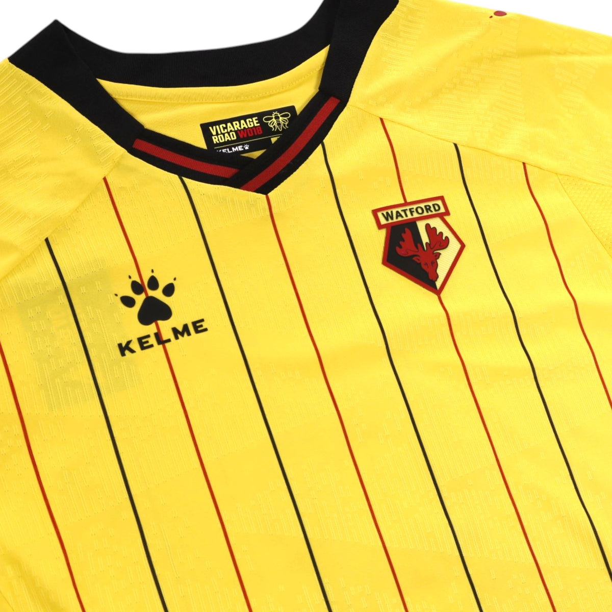 Collar and chest detail showing Kelme logo, Watford crest and neck tag