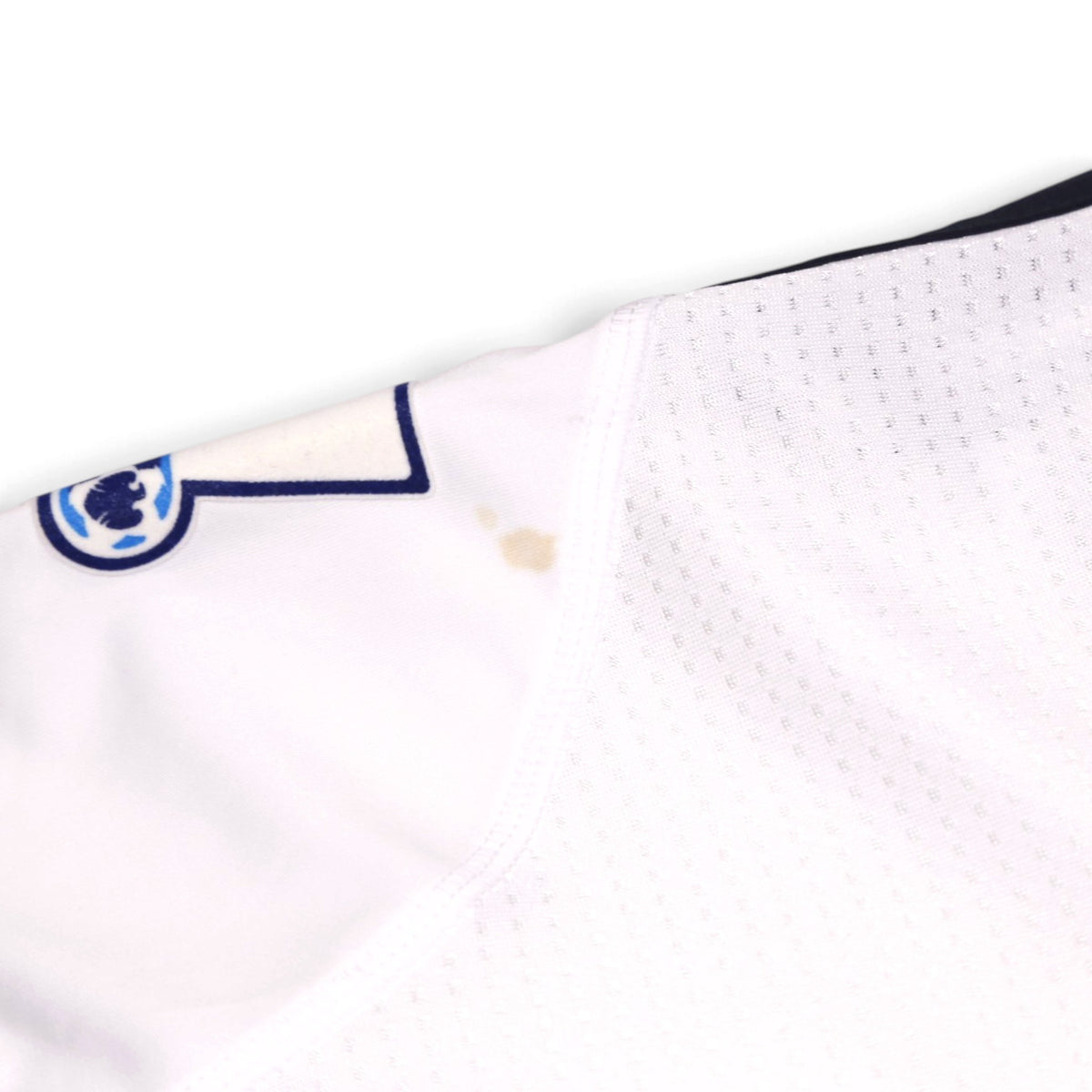 Close-up of the collar area showing a small stain near the seam