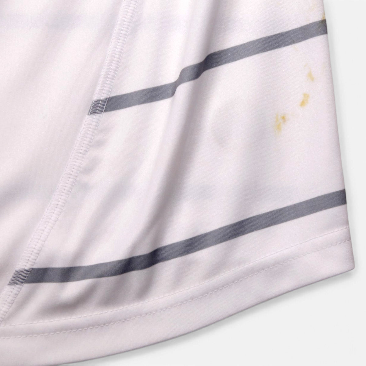 Close-up of the lower hem showing light marks on the fabric