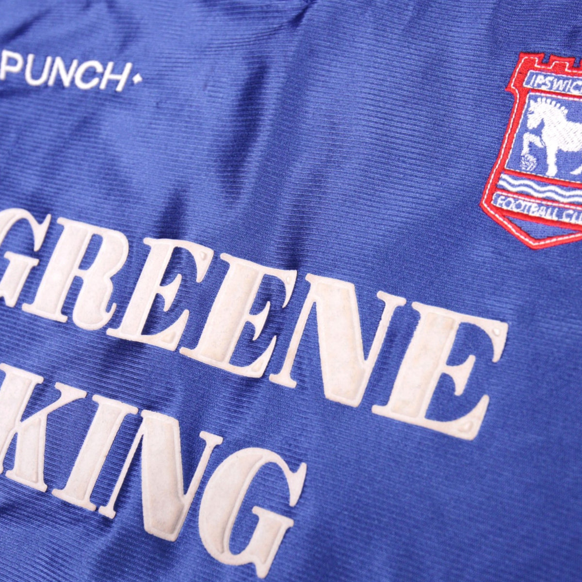 Close-up of cracked print on the rear name lettering of the Ipswich Town shirt