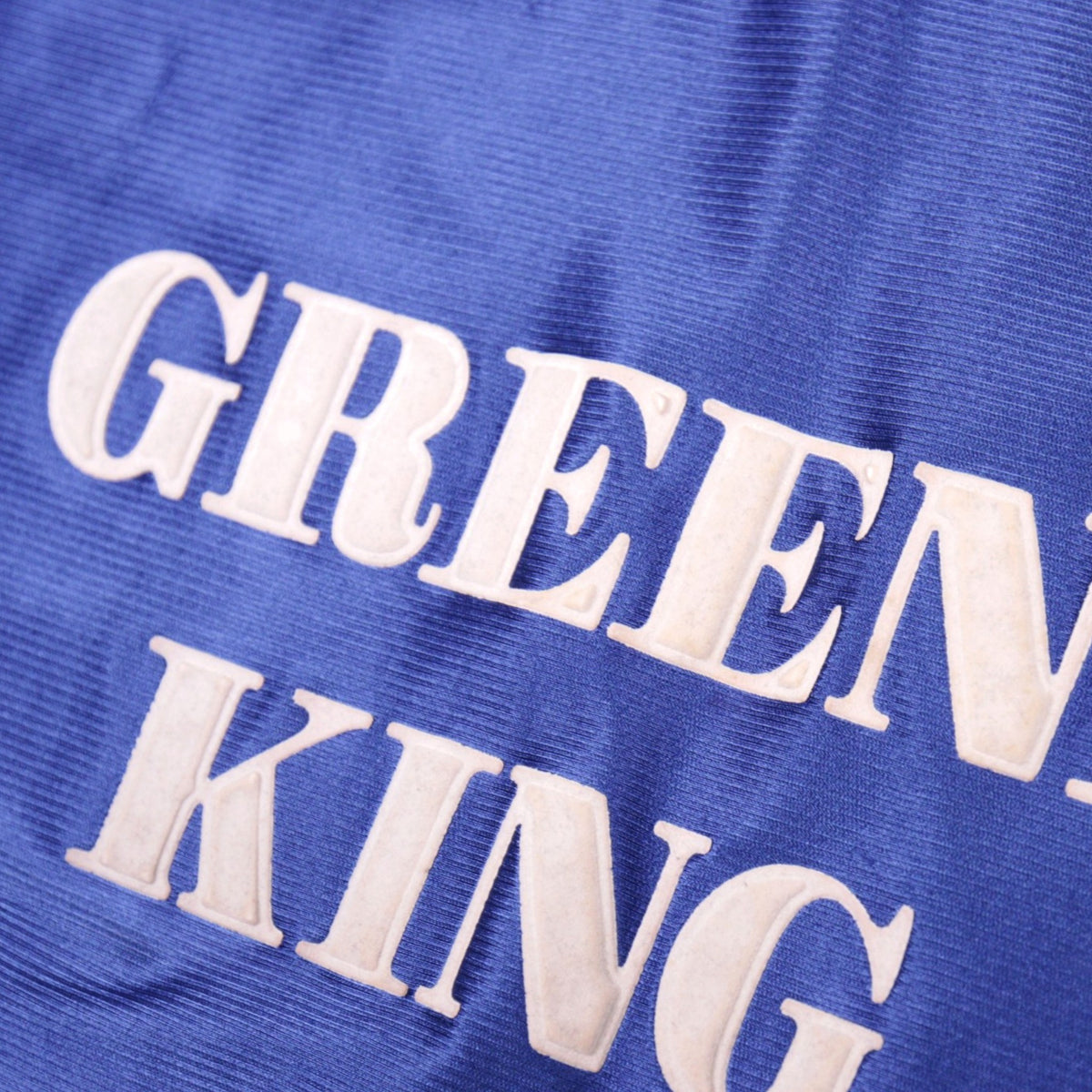 Close-up of the Greene King sponsor print on the Ipswich Town shirt