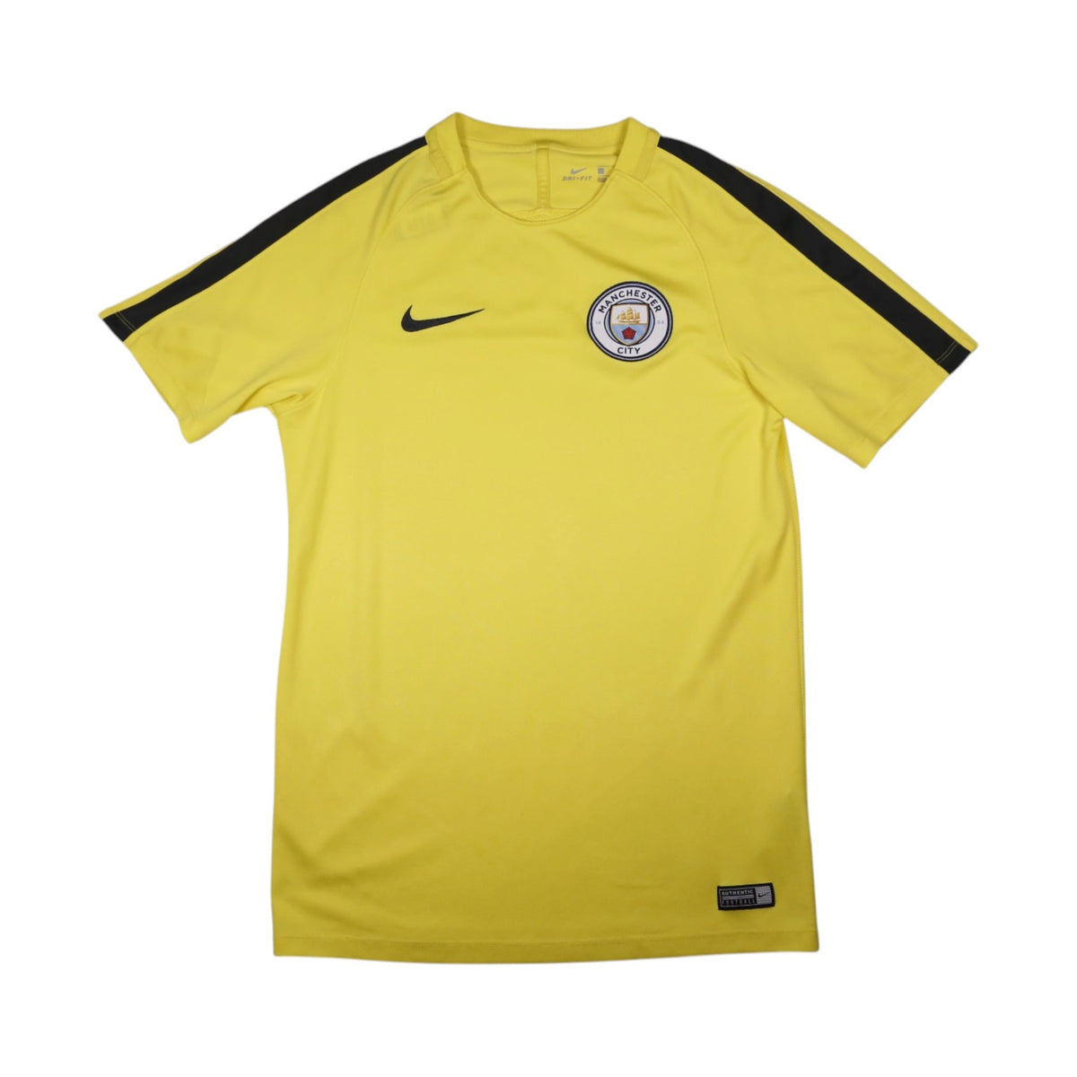 Manchester City yellow Nike training shirt front view with crest and swoosh