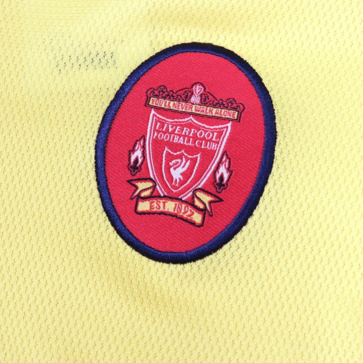 Close-up of the Liverpool crest reading You'll Never Walk Alone and Est. 1892