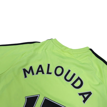 Close-up of the ribbed collar and shoulder seam on the Chelsea away shirt