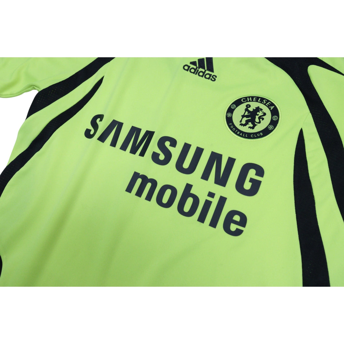Close-up of the adidas logo and Chelsea crest on the chest