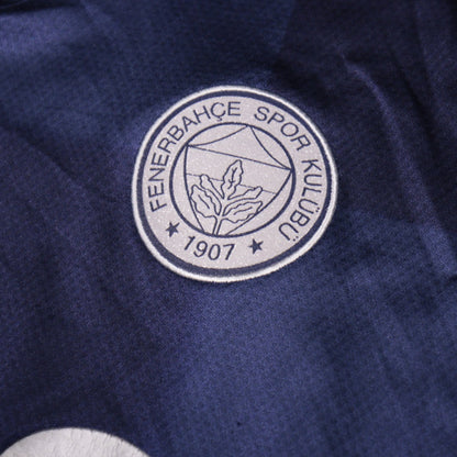 Close-up of the Fenerbahçe 1907 crest on the shirt