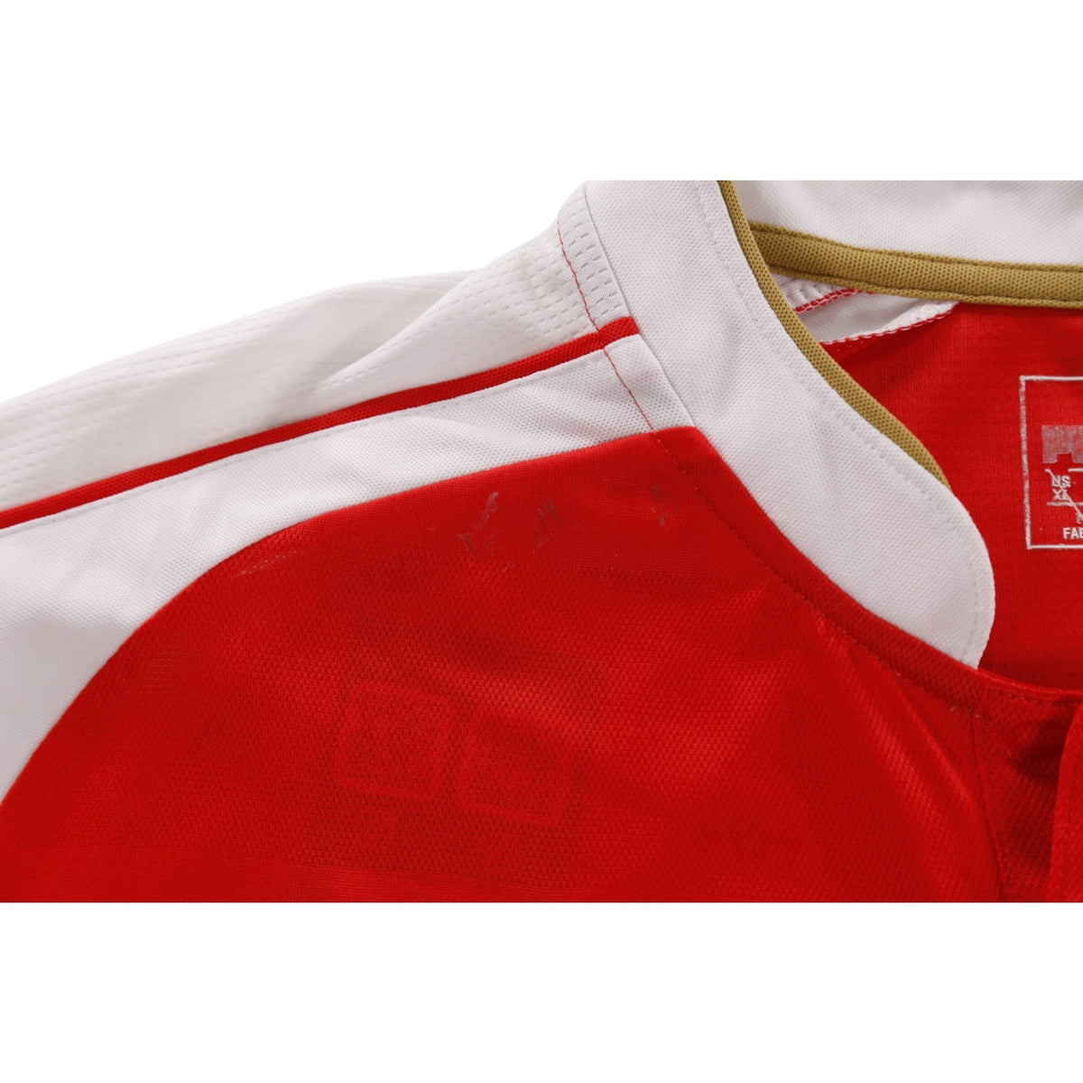 Close-up of collar and Puma neck label on Arsenal home shirt
