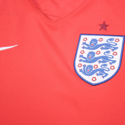Close-up of FA three lions crest and Nike swoosh on England away shirt