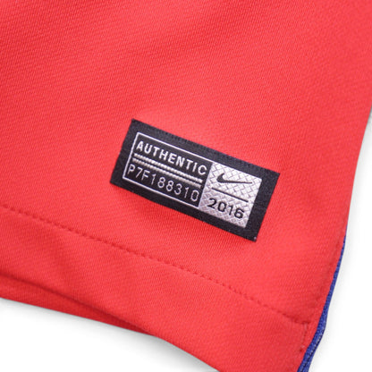 Close-up of woven Nike authentic tag dated 2016 on England away shirt hem