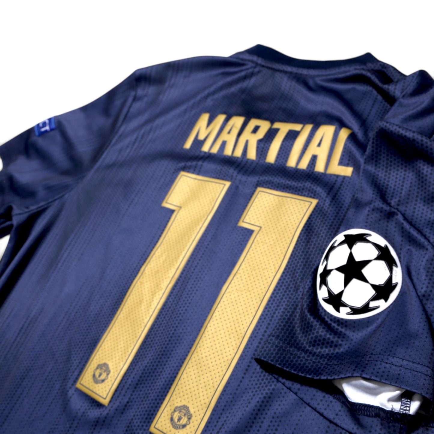 Close-up of Martial 11 print and Champions League sleeve badge on 2018/19 Manchester United third shirt