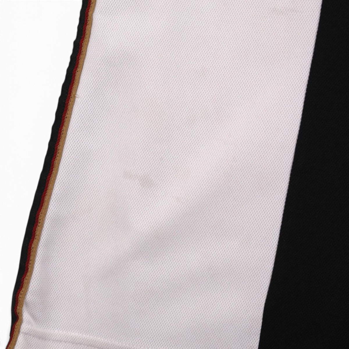 Close-up of side seam trim and fabric on Germany home shirt