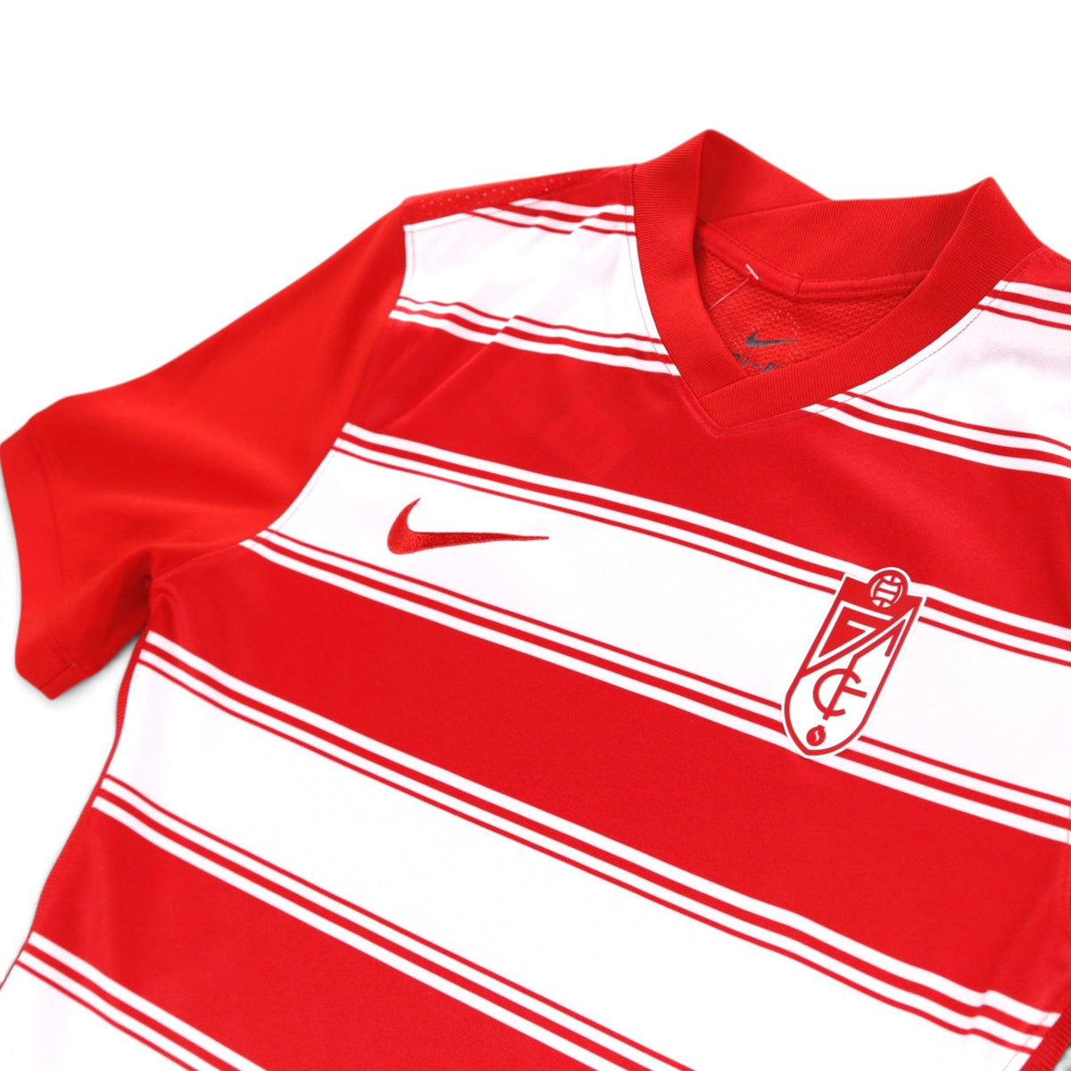 Close-up of Granada 2021/22 home shirt collar, Nike swoosh and crest detail