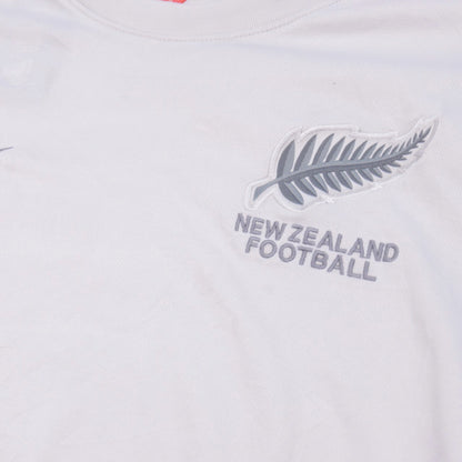 Close-up of New Zealand Football crest and wordmark on chest