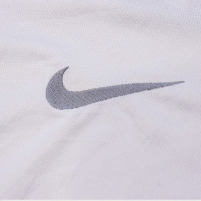 Close-up of the Nike swoosh logo on the chest