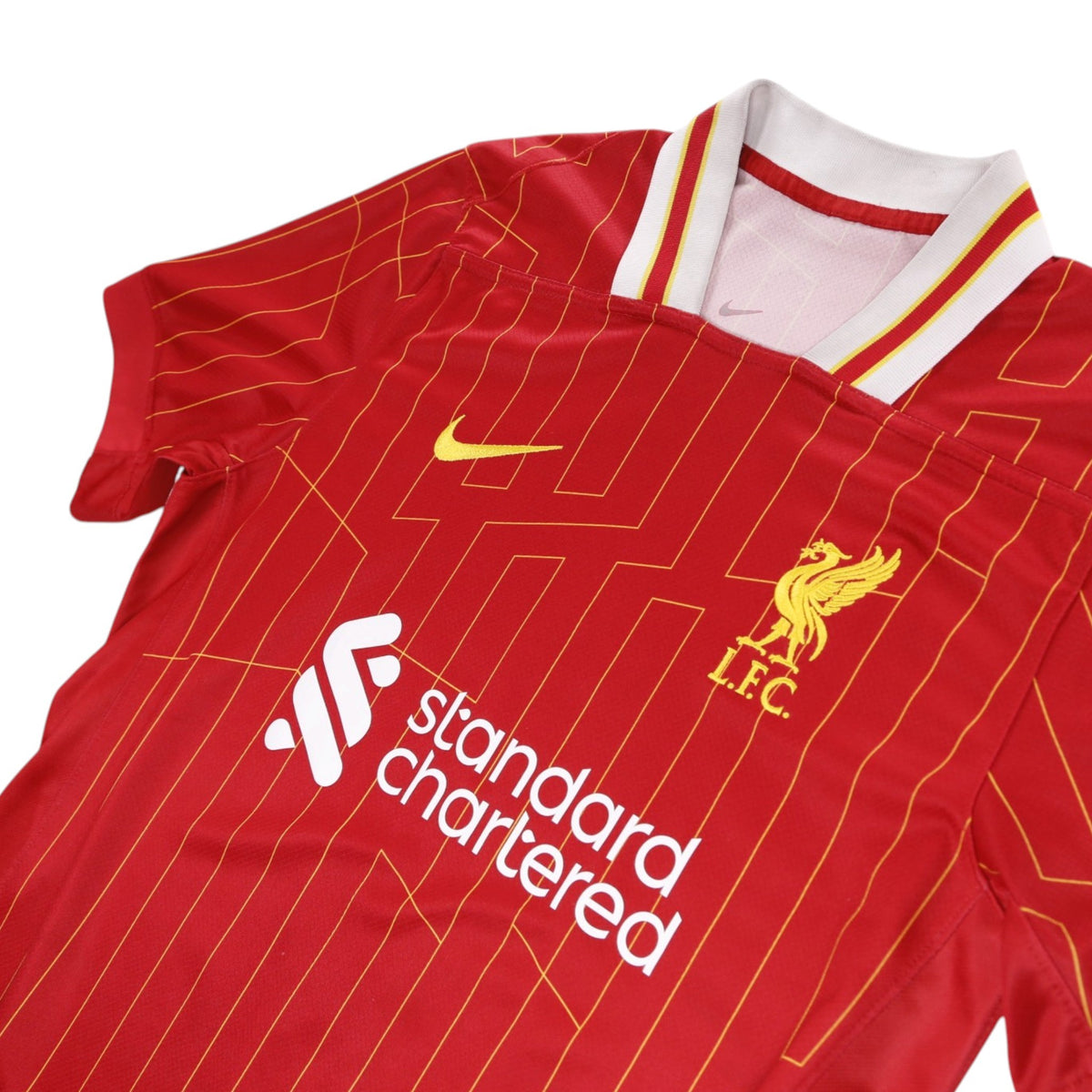 Close-up of Liverpool crest, Nike logo and collar detail
