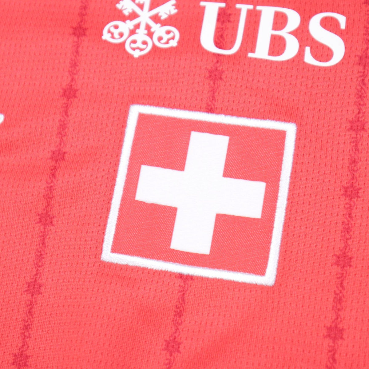 Detail of Swiss cross crest showing fabric and print condition