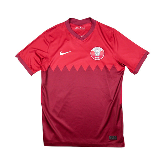 Front view of the Qatar Nike home football shirt, red with maroon zigzag pattern